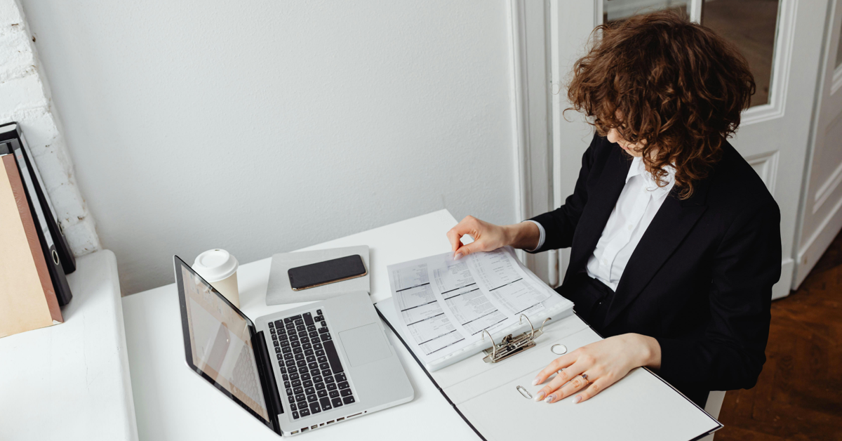 Female lawyer going through courtroom related documents and transcriptions